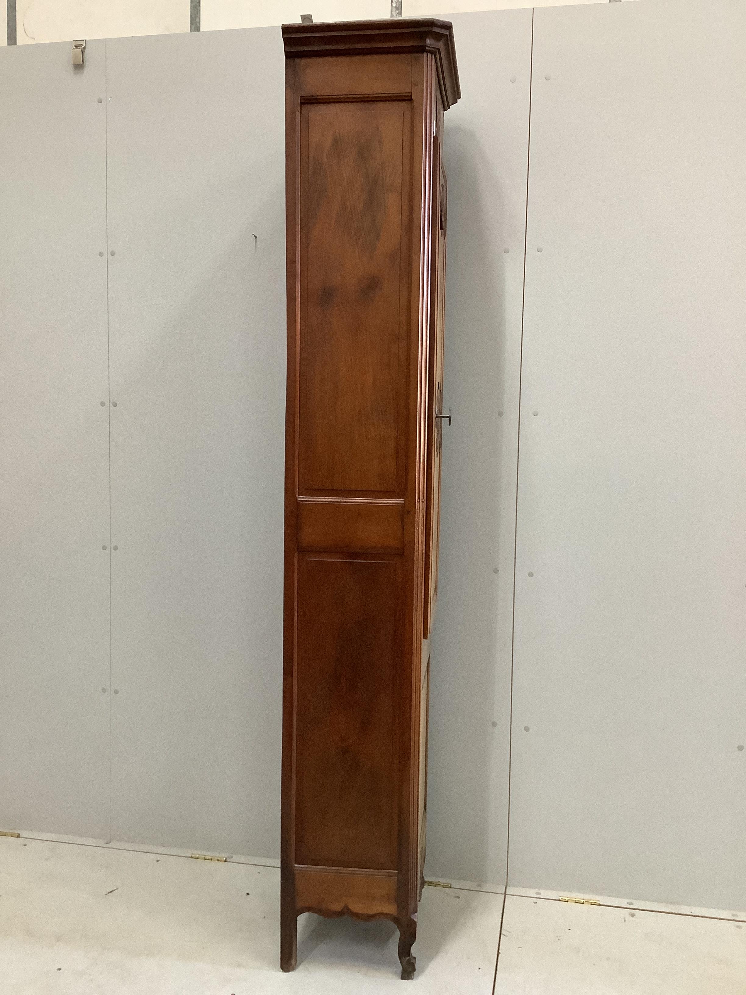 A Louis XV style narrow walnut cabinet, width 48cm, depth 36cm, height 215cm